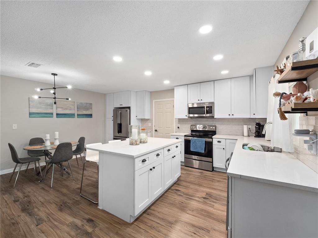 2733 Middle Street Orlando, FL 32807 - Photo 8 of 23 a kitchen with a sink microwave and cabinets