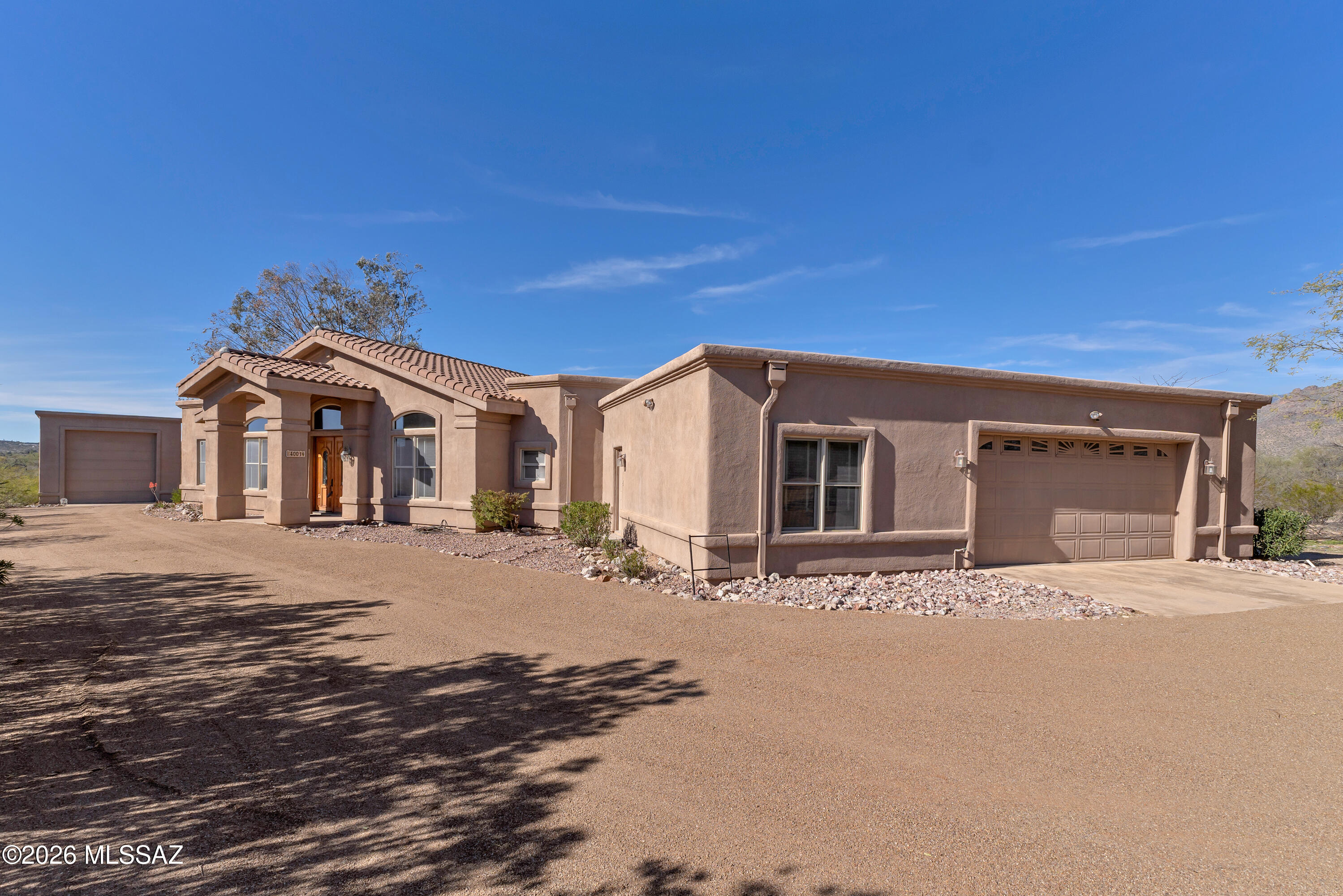 4001 North Harrison Road Tucson, AZ 85749 - Photo 4 of 50 a front view of a house with a yard