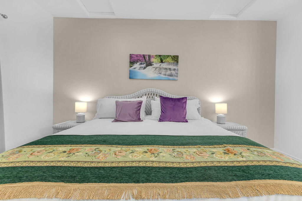 12622 Miracle Hill Road Desert Hot Springs, CA 92240 - Photo 50 of 124 a bedroom with a bed and a night stand