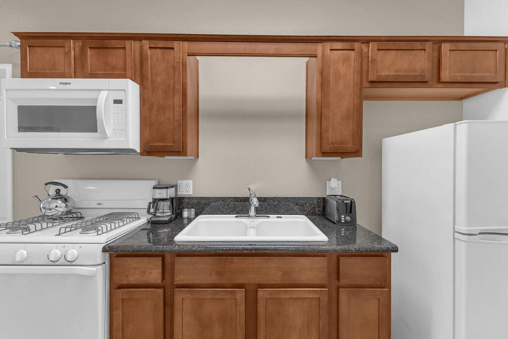 12622 Miracle Hill Road Desert Hot Springs, CA 92240 - Photo 60 of 124 a bathroom with a sink and a mirror