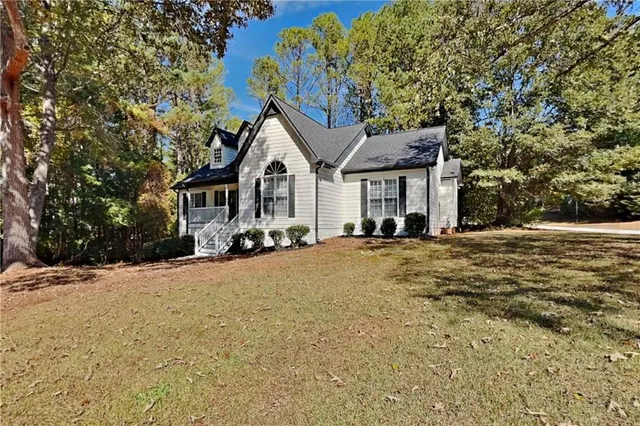 a front view of a house with a yard