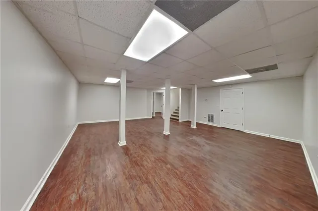 a view of a room with wooden floor