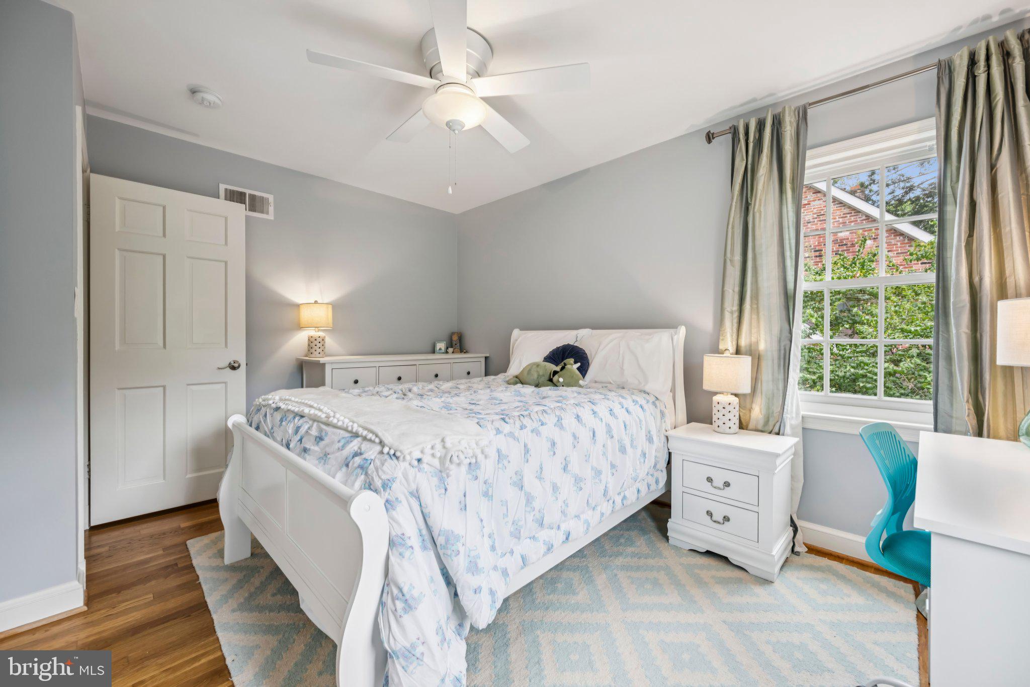 5109 River Hill Road Bethesda, MD 20816 - Photo 13 of 21 a bedroom with a bed and a window