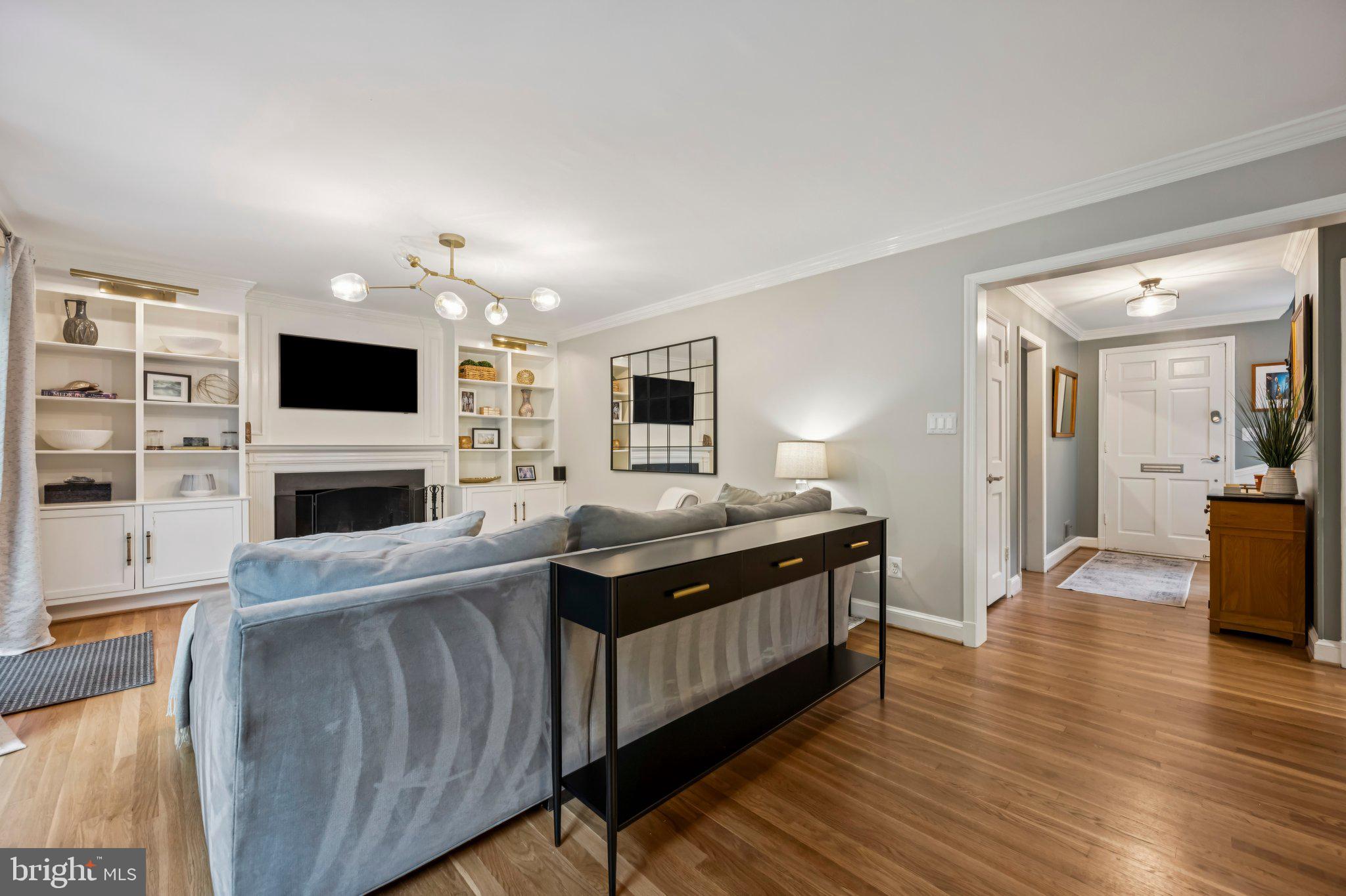 5109 River Hill Road Bethesda, MD 20816 - Photo 8 of 21 a view of living room kitchen with stainless steel appliances furniture stove and cabinets
