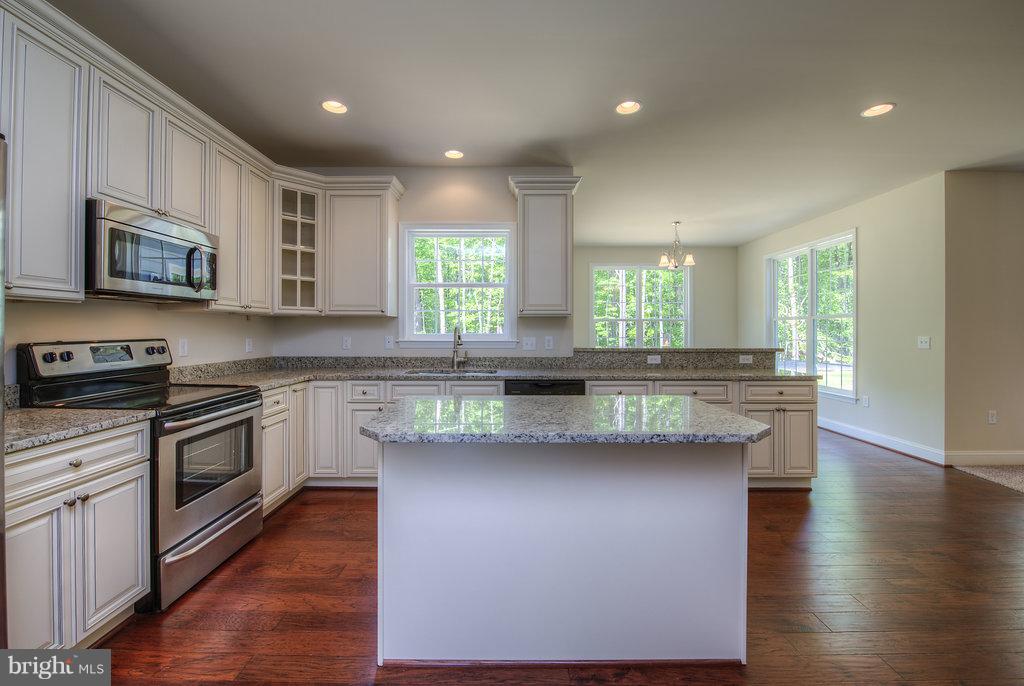 Kitchen looking into sunroom