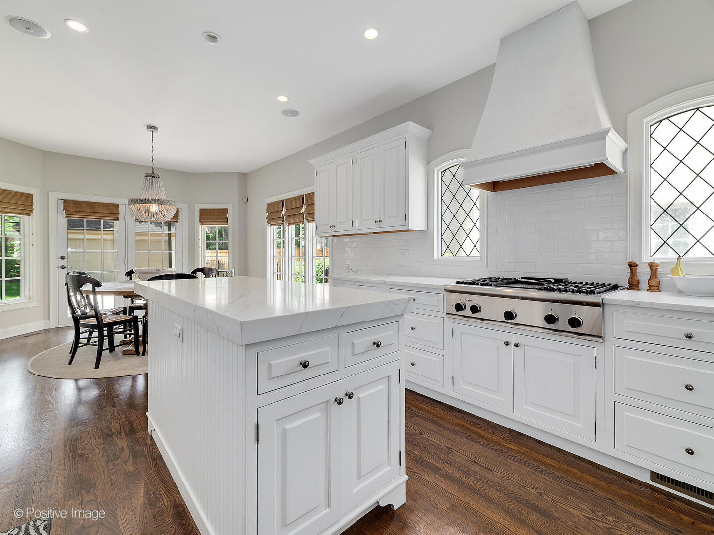 308 North County Line Road Hinsdale, IL 60521 - Photo 15 of 40 a kitchen with white cabinets and appliances