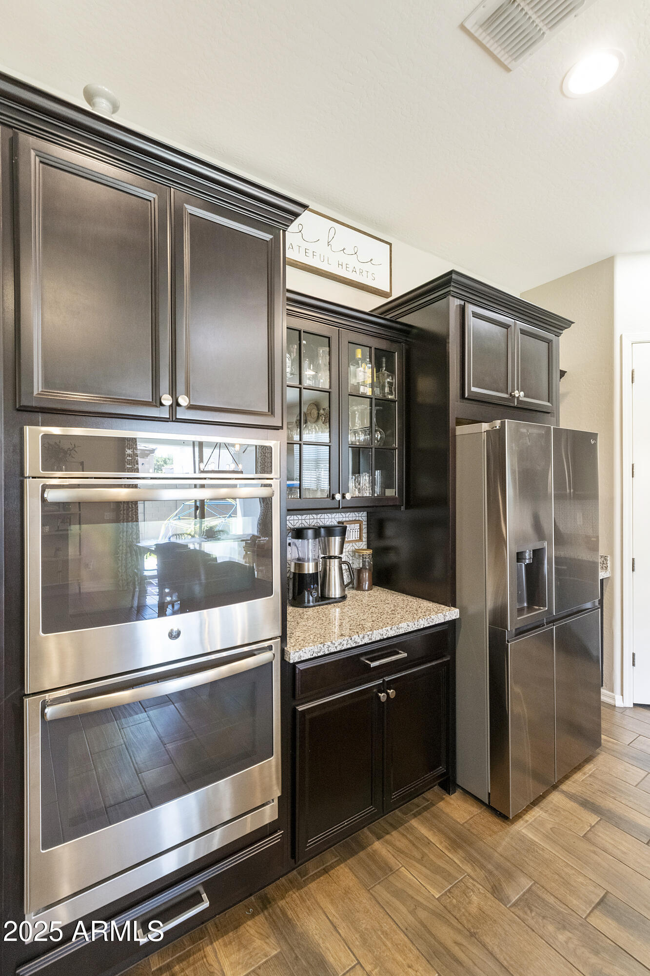 1517 West Redondo Drive Gilbert, AZ 85233 - Photo 11 of 55 a kitchen with kitchen island granite countertop stainless steel appliances and counter space