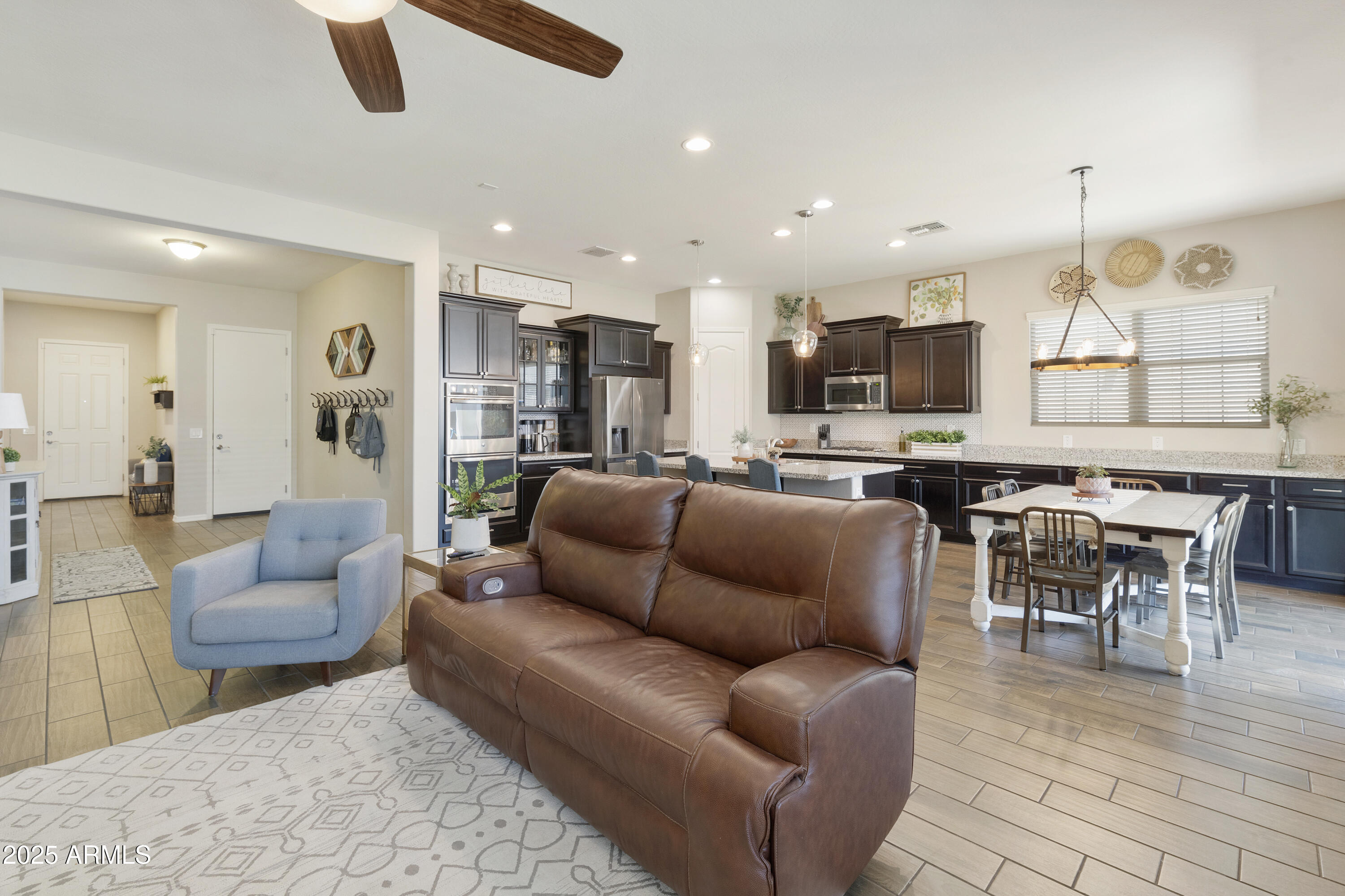1517 West Redondo Drive Gilbert, AZ 85233 - Photo 14 of 55 a living room kitchen with furniture and a view of kitchen