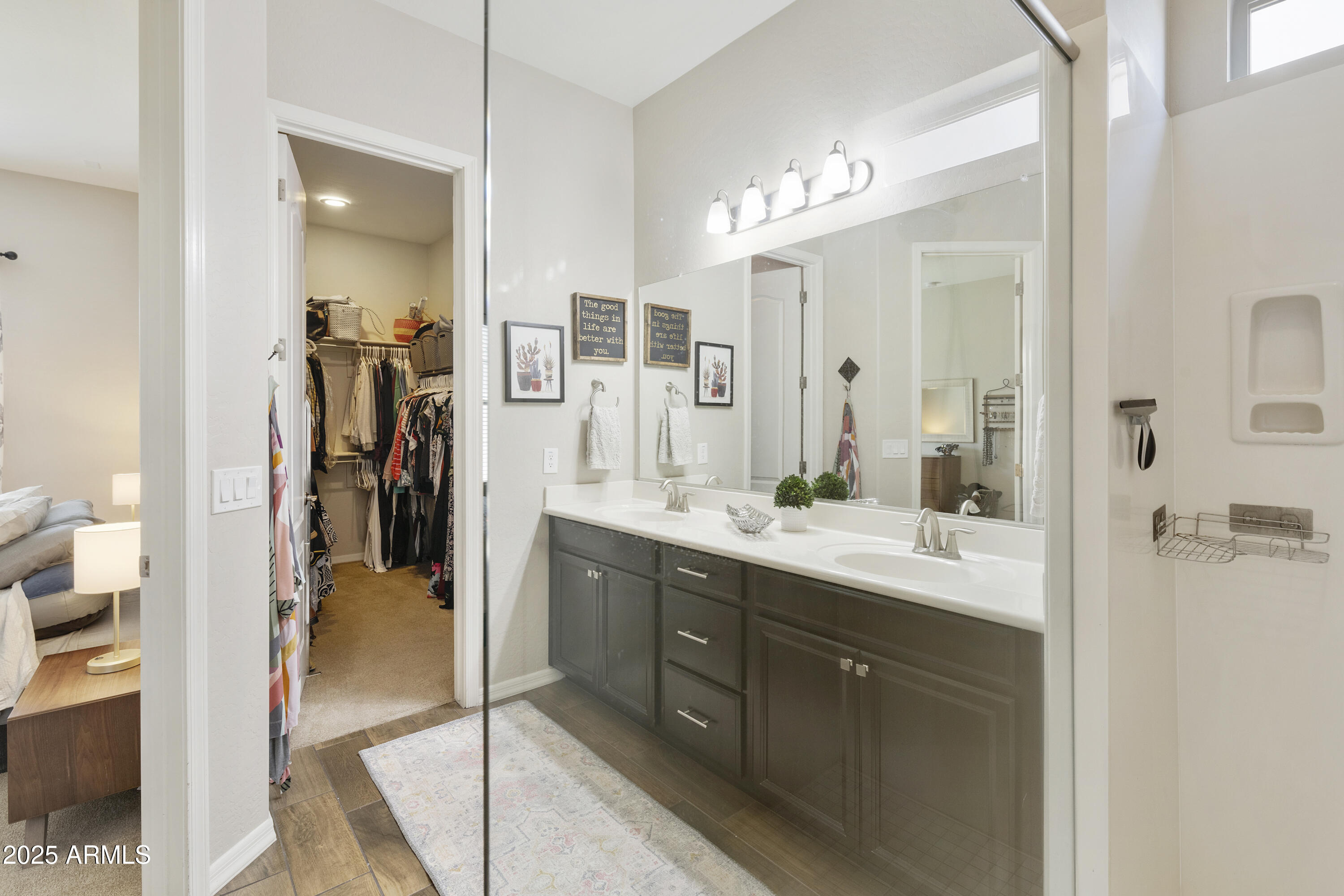 1517 West Redondo Drive Gilbert, AZ 85233 - Photo 21 of 55 a en suite bathroom with a sink a mirror and a shower