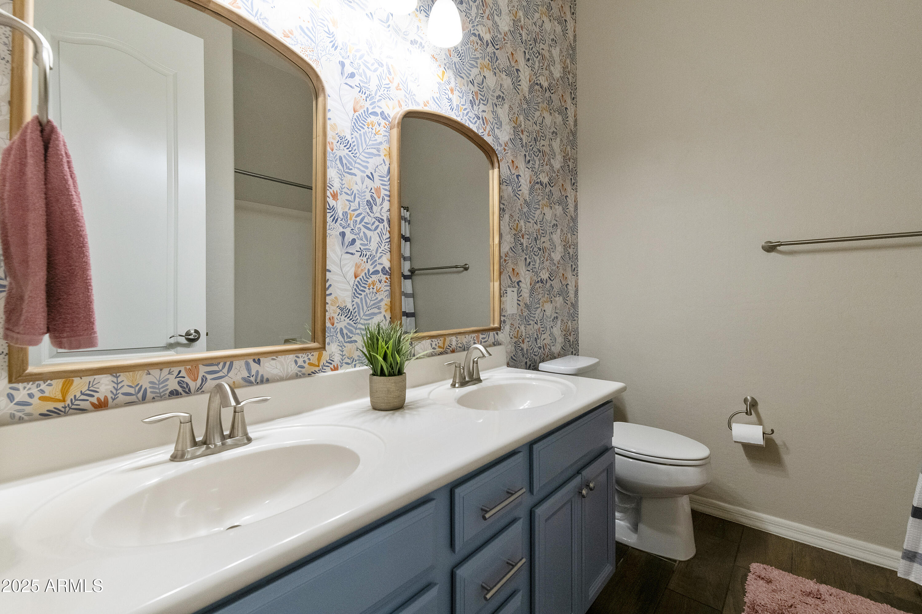 1517 West Redondo Drive Gilbert, AZ 85233 - Photo 25 of 55 a bathroom with a granite countertop toilet a sink and a mirror