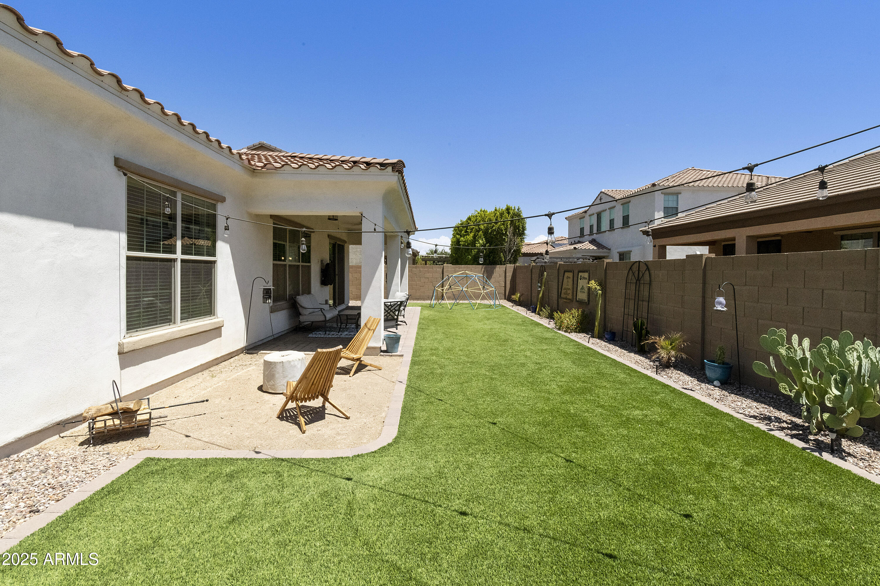 1517 West Redondo Drive Gilbert, AZ 85233 - Photo 36 of 55 a view of a backyard with a patio and a garden