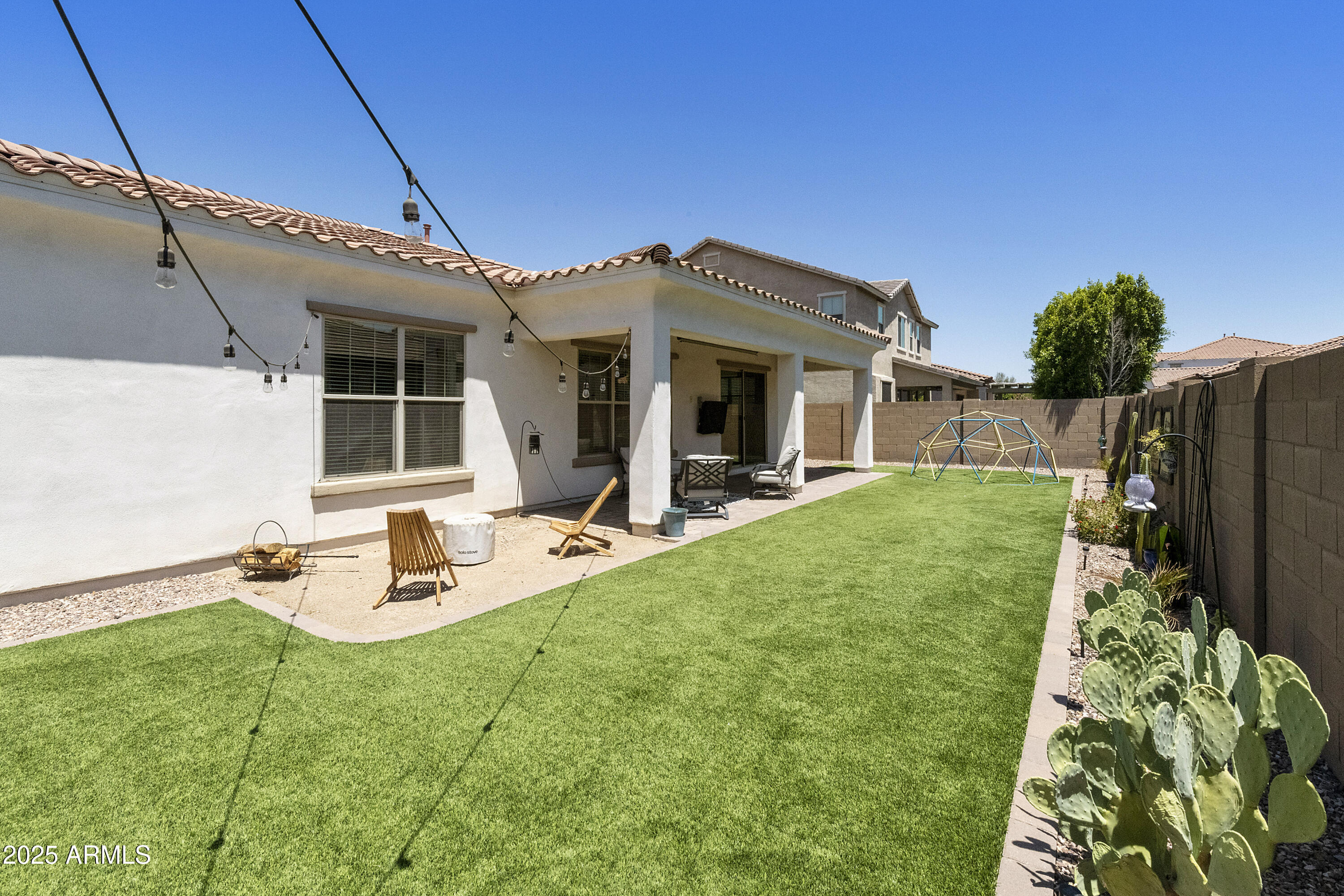 1517 West Redondo Drive Gilbert, AZ 85233 - Photo 37 of 55 a view of a house with backyard and sitting area