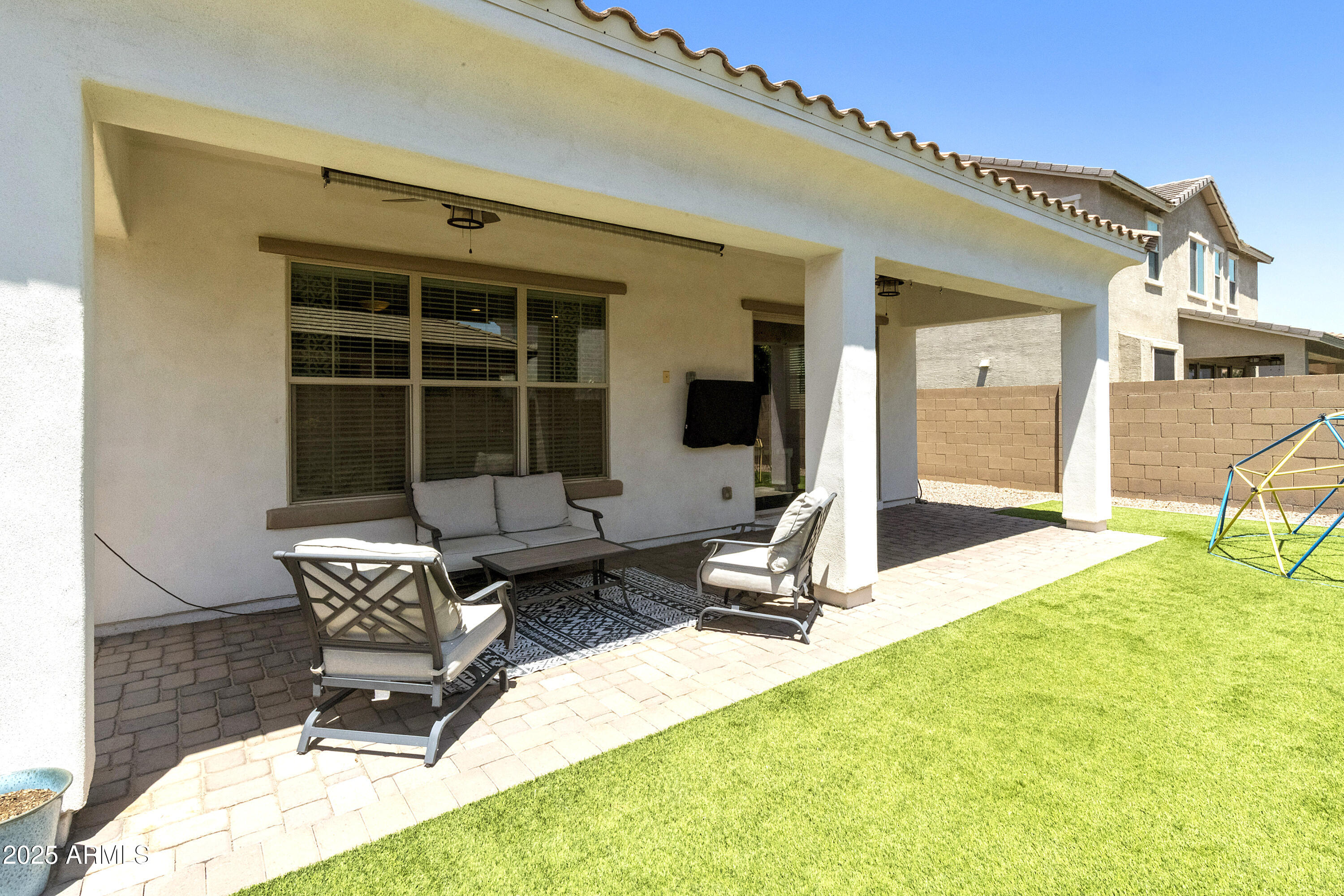 1517 West Redondo Drive Gilbert, AZ 85233 - Photo 38 of 55 a bench is sitting in front of a house