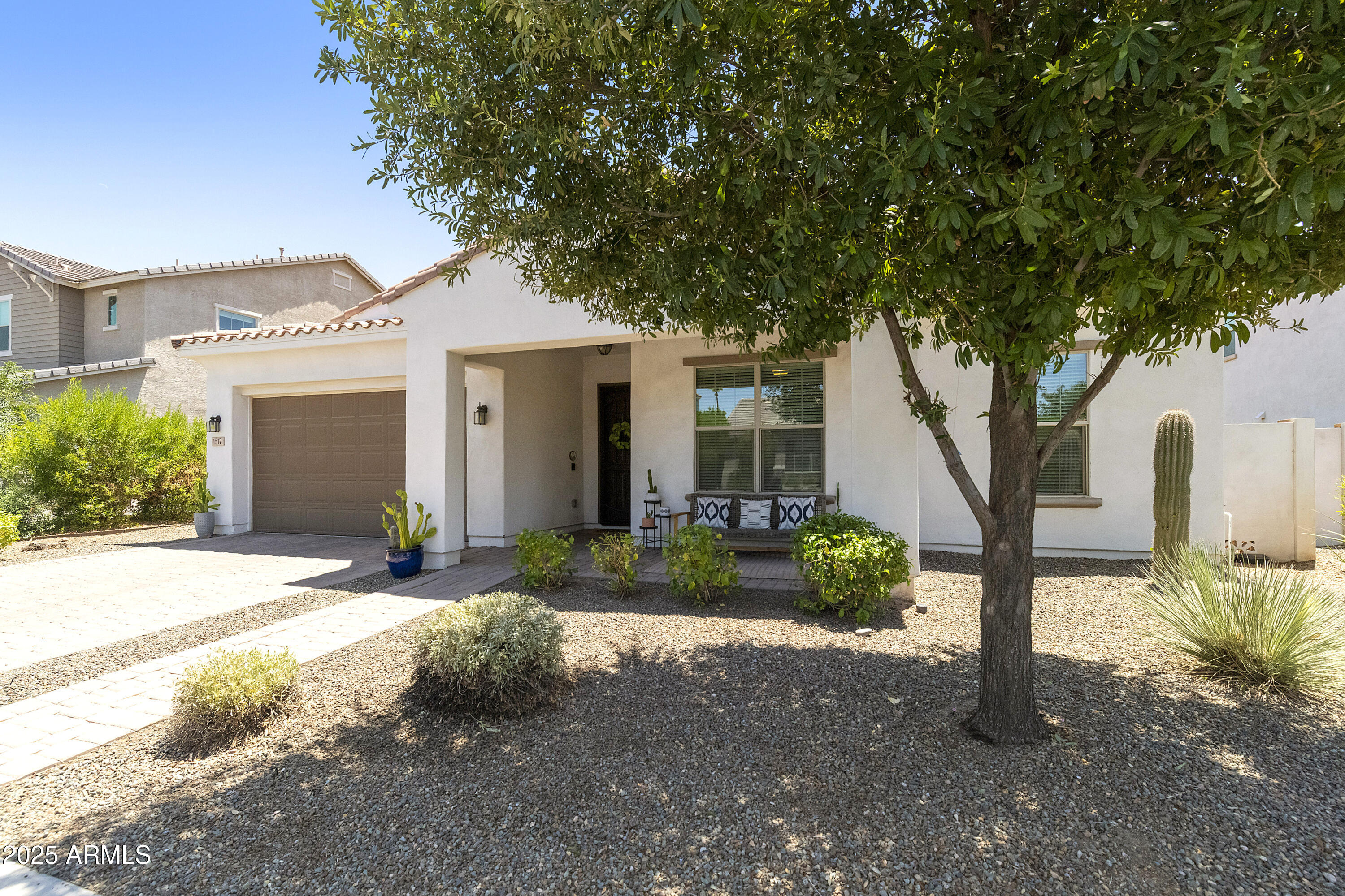 1517 West Redondo Drive Gilbert, AZ 85233 - Photo 41 of 55 a front view of a house with garden
