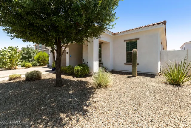 a front view of a house with outdoor seating