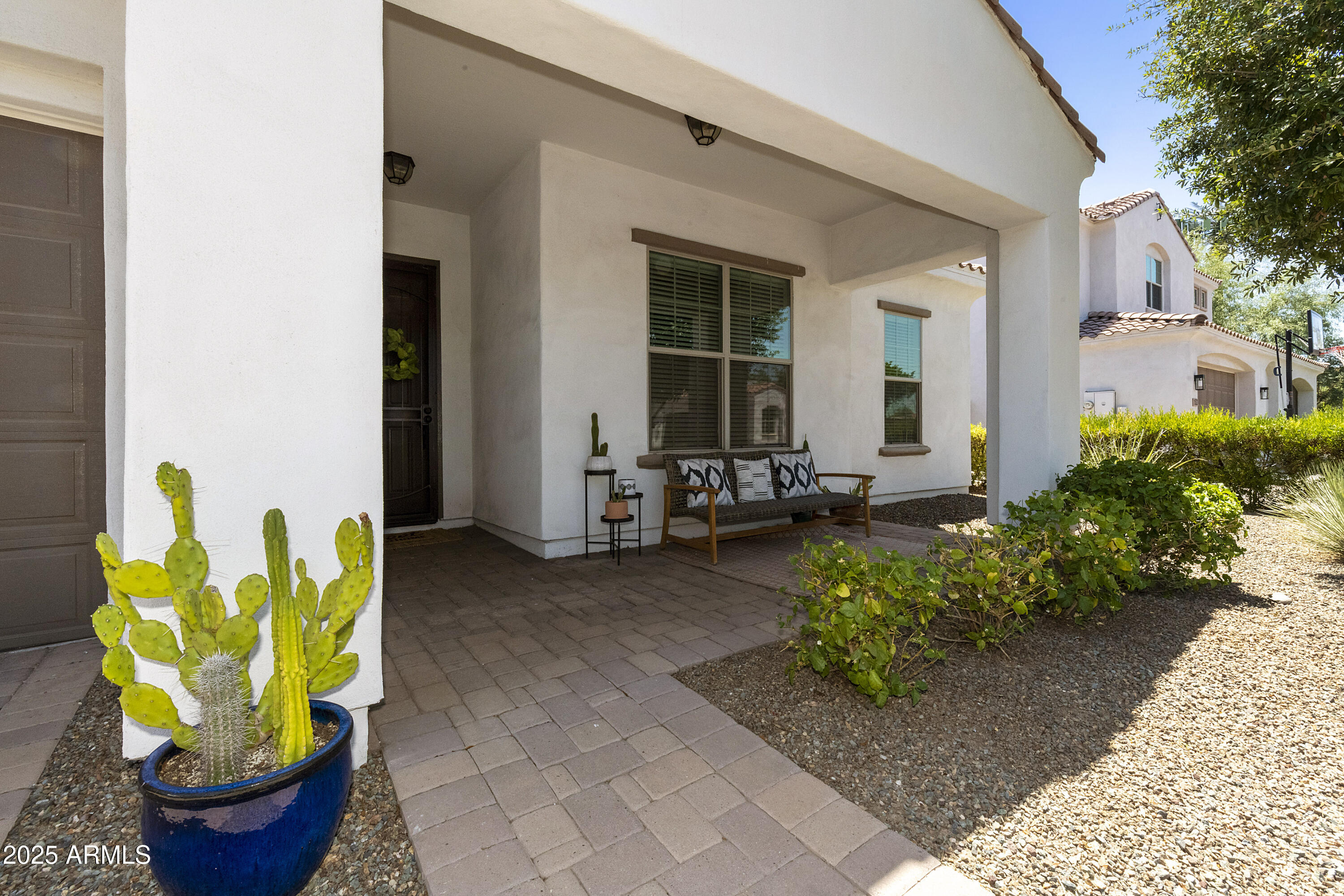 1517 West Redondo Drive Gilbert, AZ 85233 - Photo 46 of 55 a front view of a house with outdoor seating