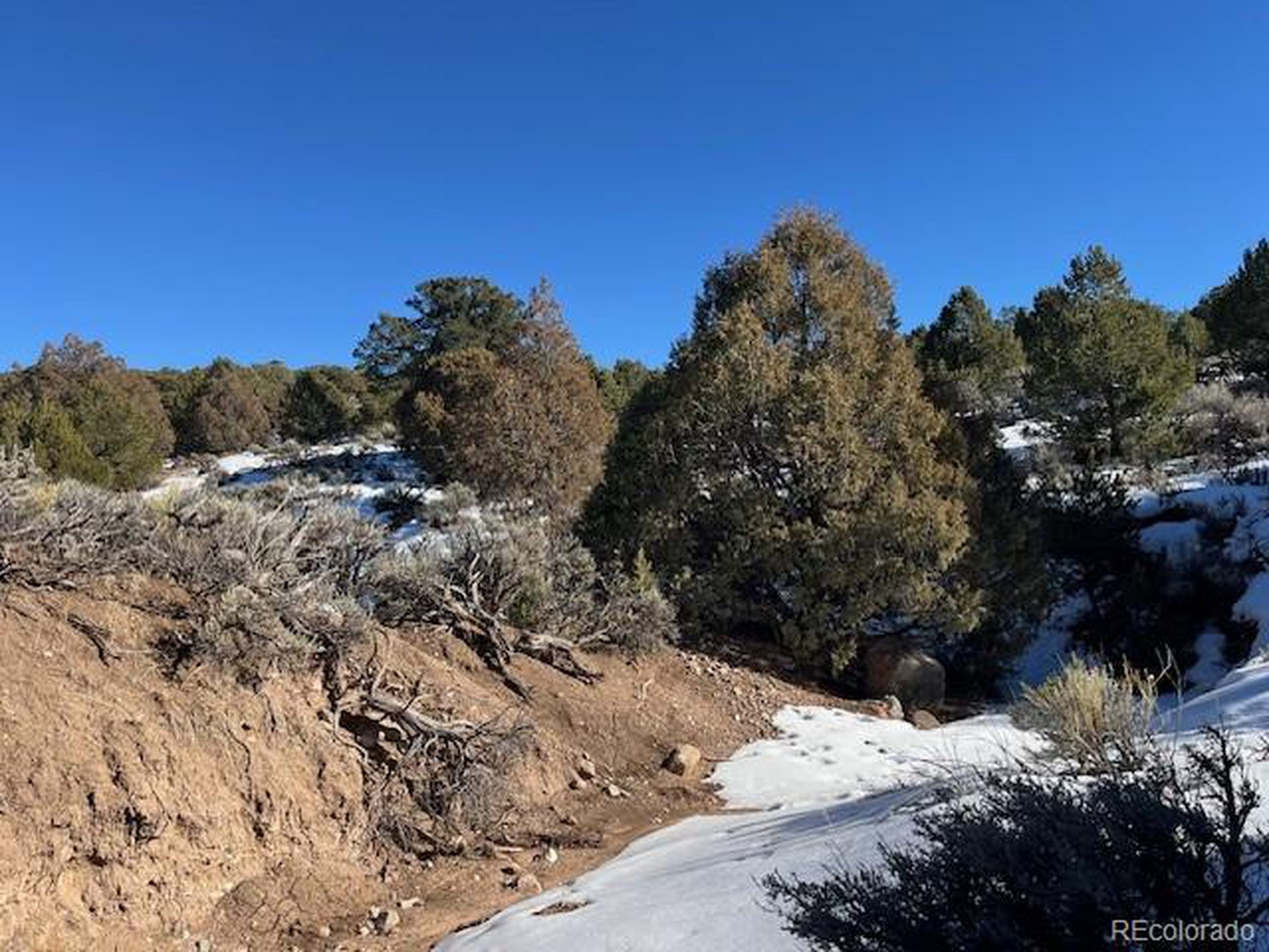 7860 Platten Road Fort Garland, CO 81133 - Photo 21 of 27 a view of a covered with snow on the road