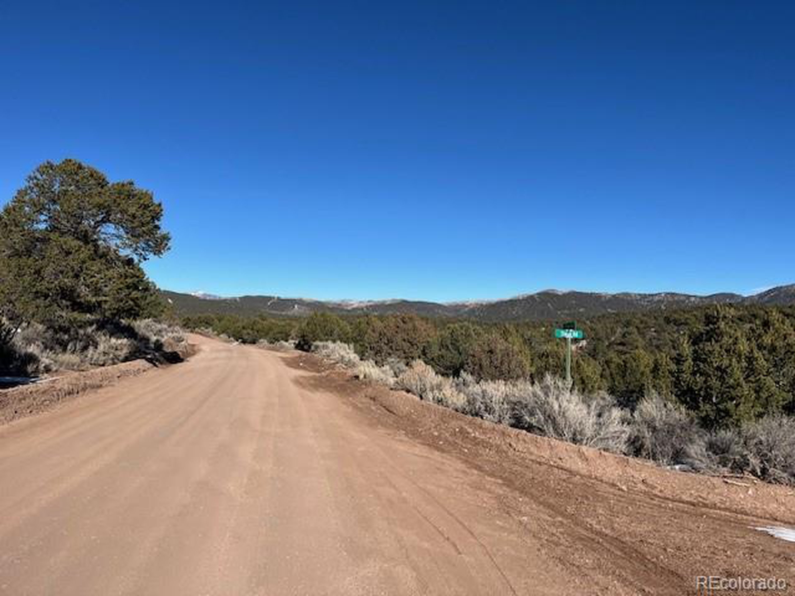 7860 Platten Road Fort Garland, CO 81133 - Photo 3 of 27 a view of a road with a building in the background
