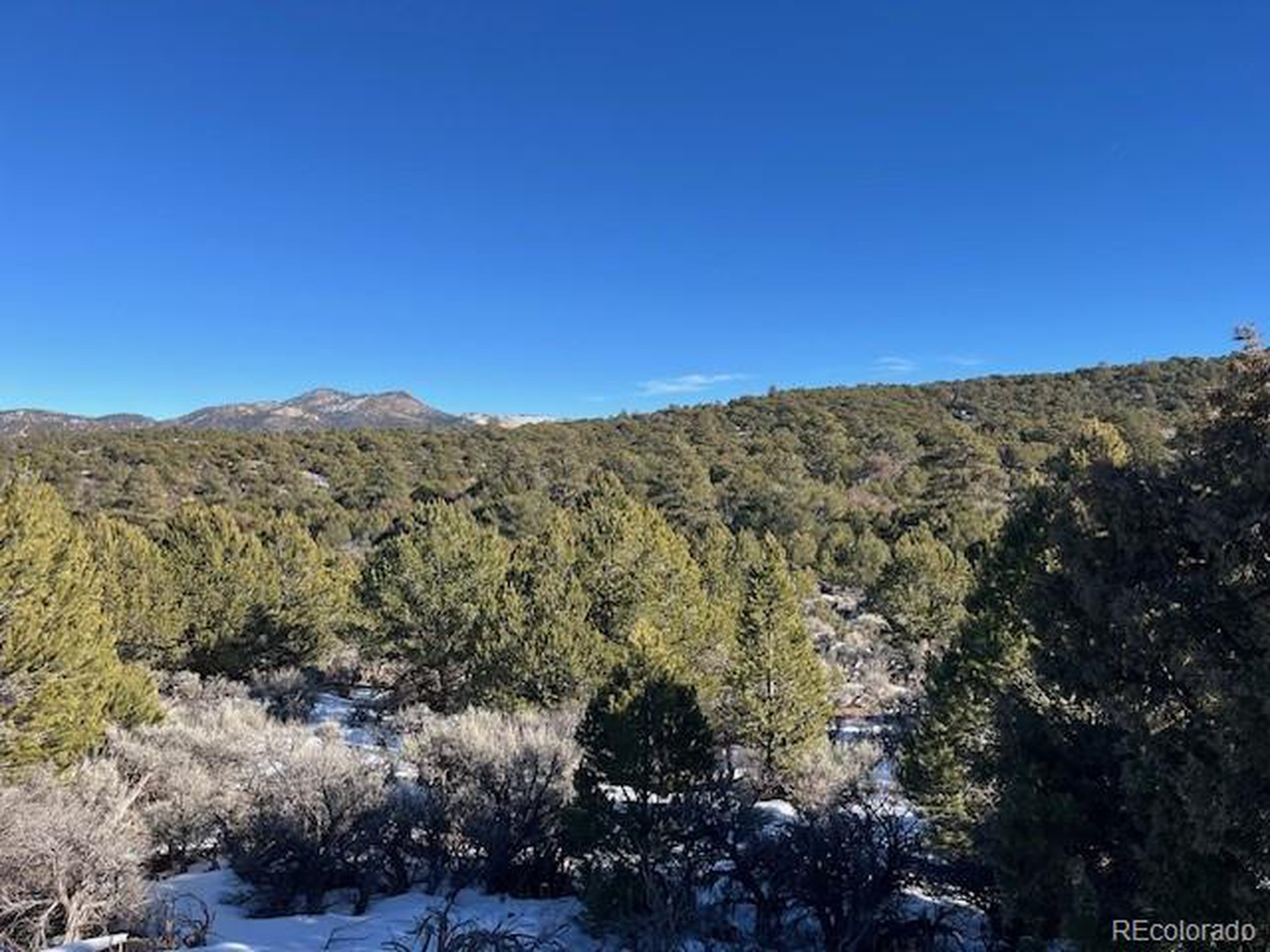 7860 Platten Road Fort Garland, CO 81133 - Photo 7 of 27 a view of a large mountain with mountains in the background