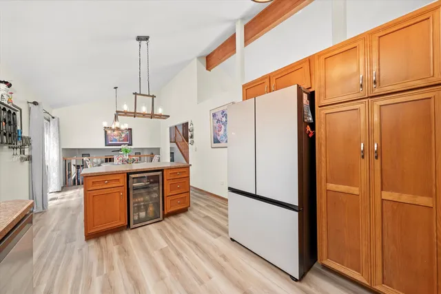 a kitchen with stainless steel appliances a refrigerator and a stove