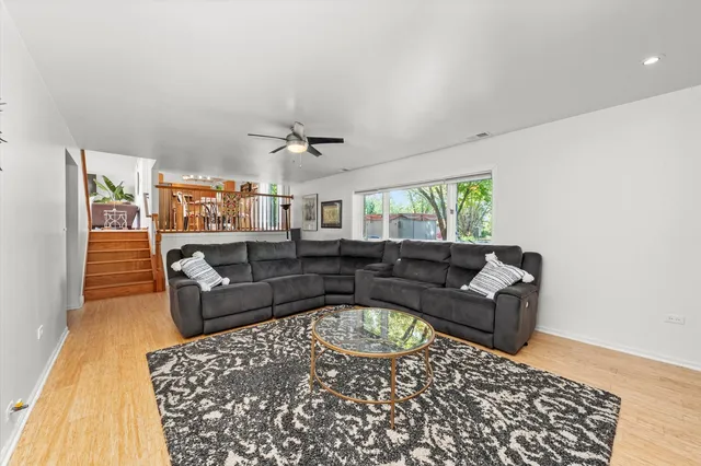 a living room with furniture and a rug