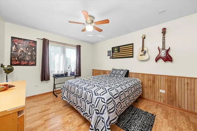 a bedroom with bed and window