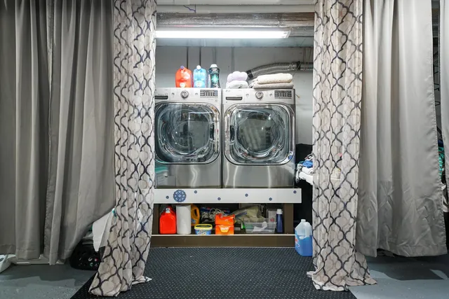 a view of a table and chairs under an umbrella in patio