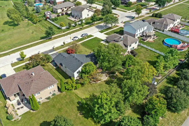 an aerial view of a house with garden space and outdoor space