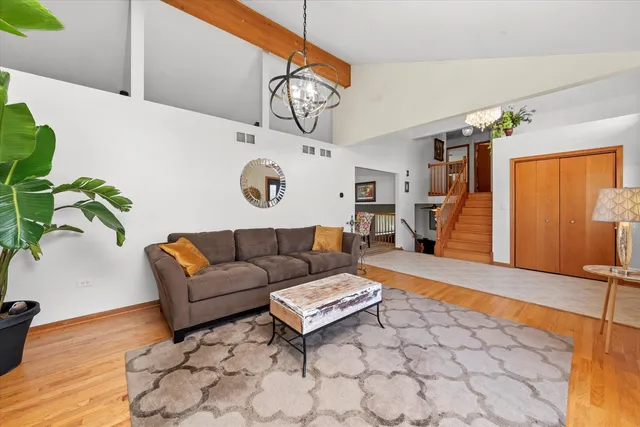 a living room with furniture and a clock