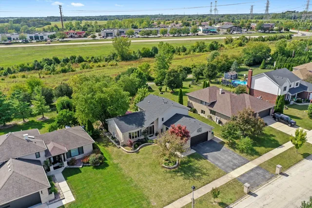a house view with swimming pool and garden