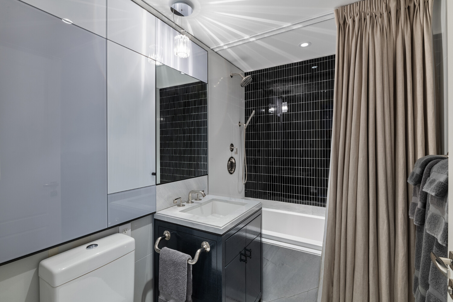 21 East 61st Street, Unit 8F Manhattan, NY 10065 - Photo 14 of 23 a bathroom with a sink and a shower