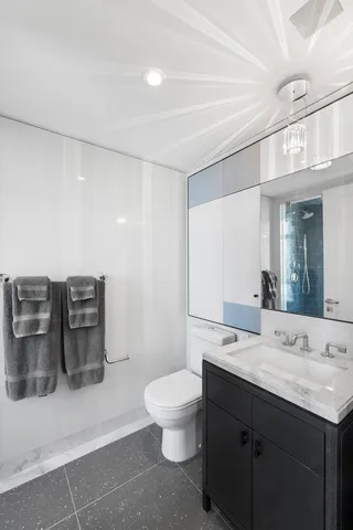 a bedroom with furniture and a lamp