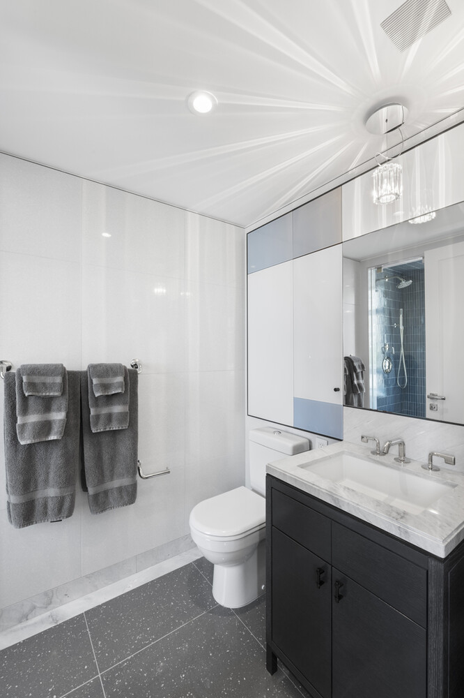 21 East 61st Street, Unit 8F Manhattan, NY 10065 - Photo 16 of 23 a bathroom with a double vanity sink mirror and toilet