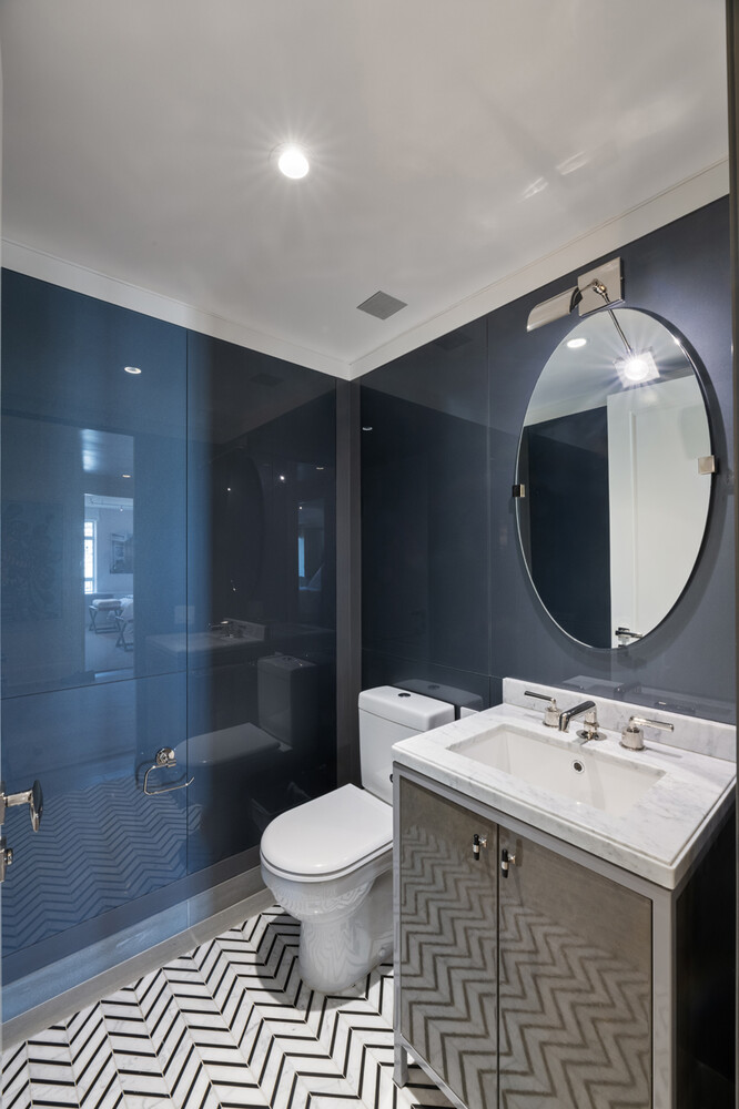 21 East 61st Street, Unit 8F Manhattan, NY 10065 - Photo 17 of 23 a spacious bathroom with a sink toilet and a mirror