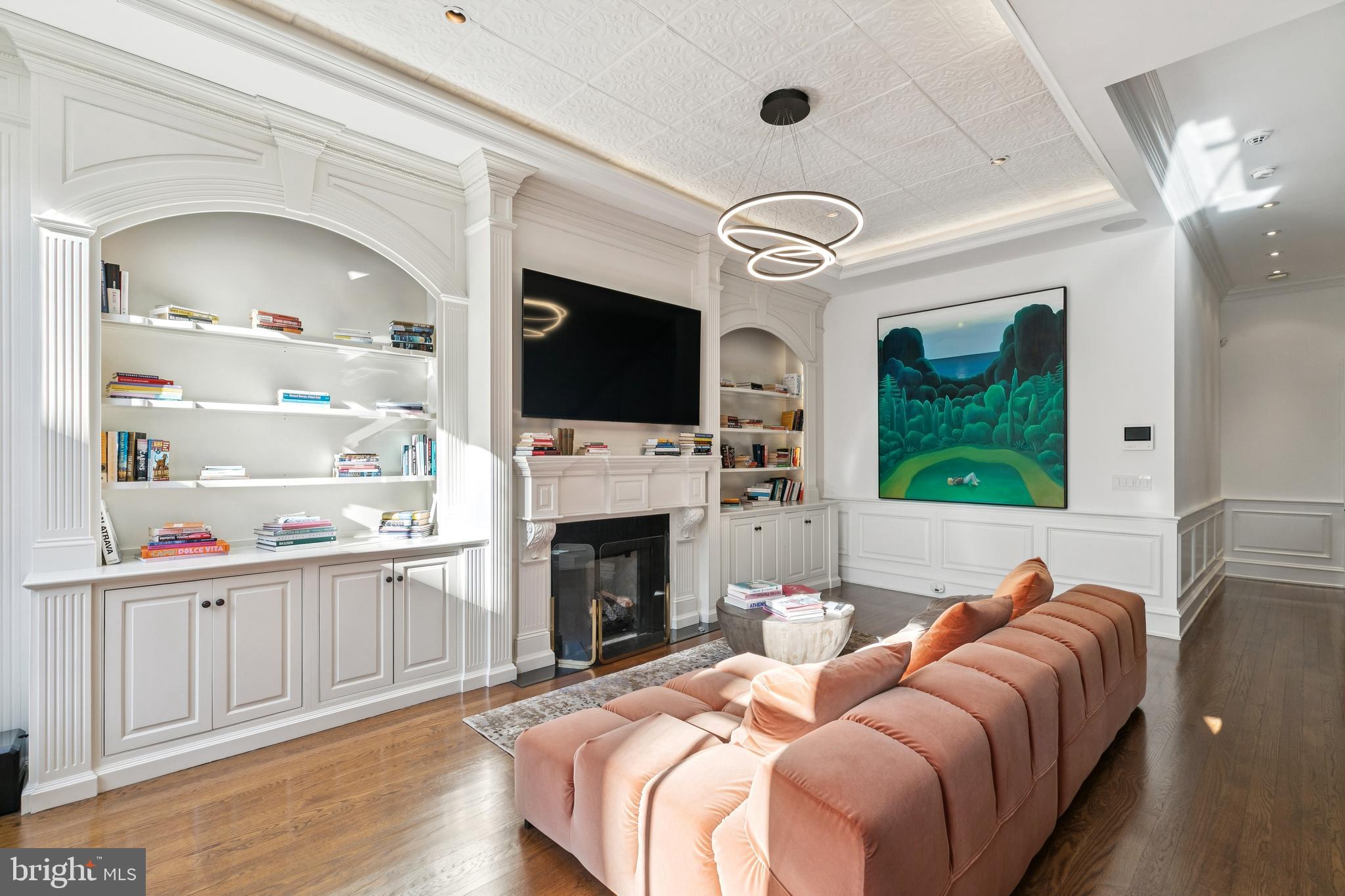 2015 Delancey Place Philadelphia, PA 19103 - Photo 14 of 38 a living room with furniture a fireplace and a flat screen tv