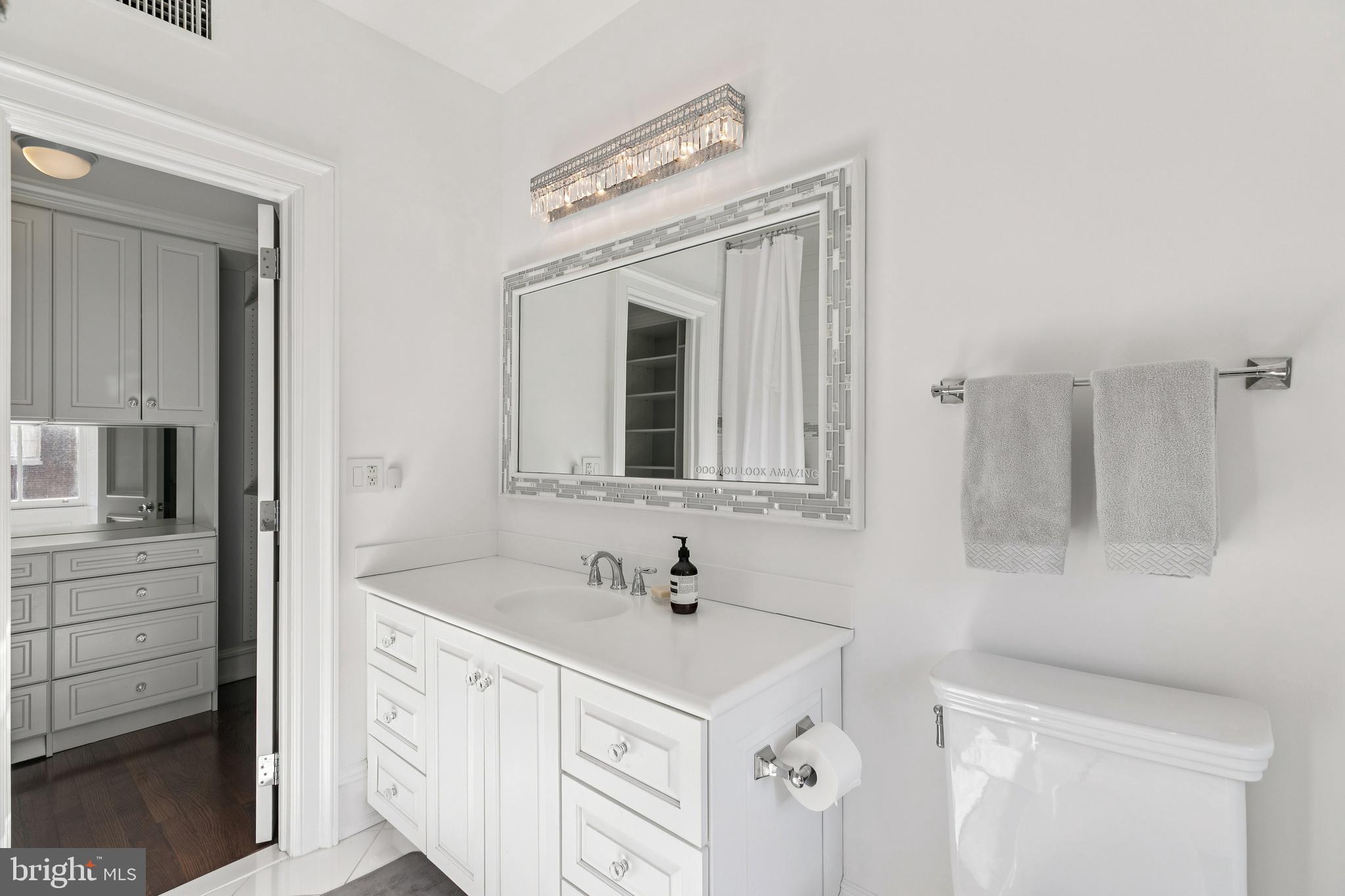 2015 Delancey Place Philadelphia, PA 19103 - Photo 23 of 38 a bathroom with a sink vanity and mirror