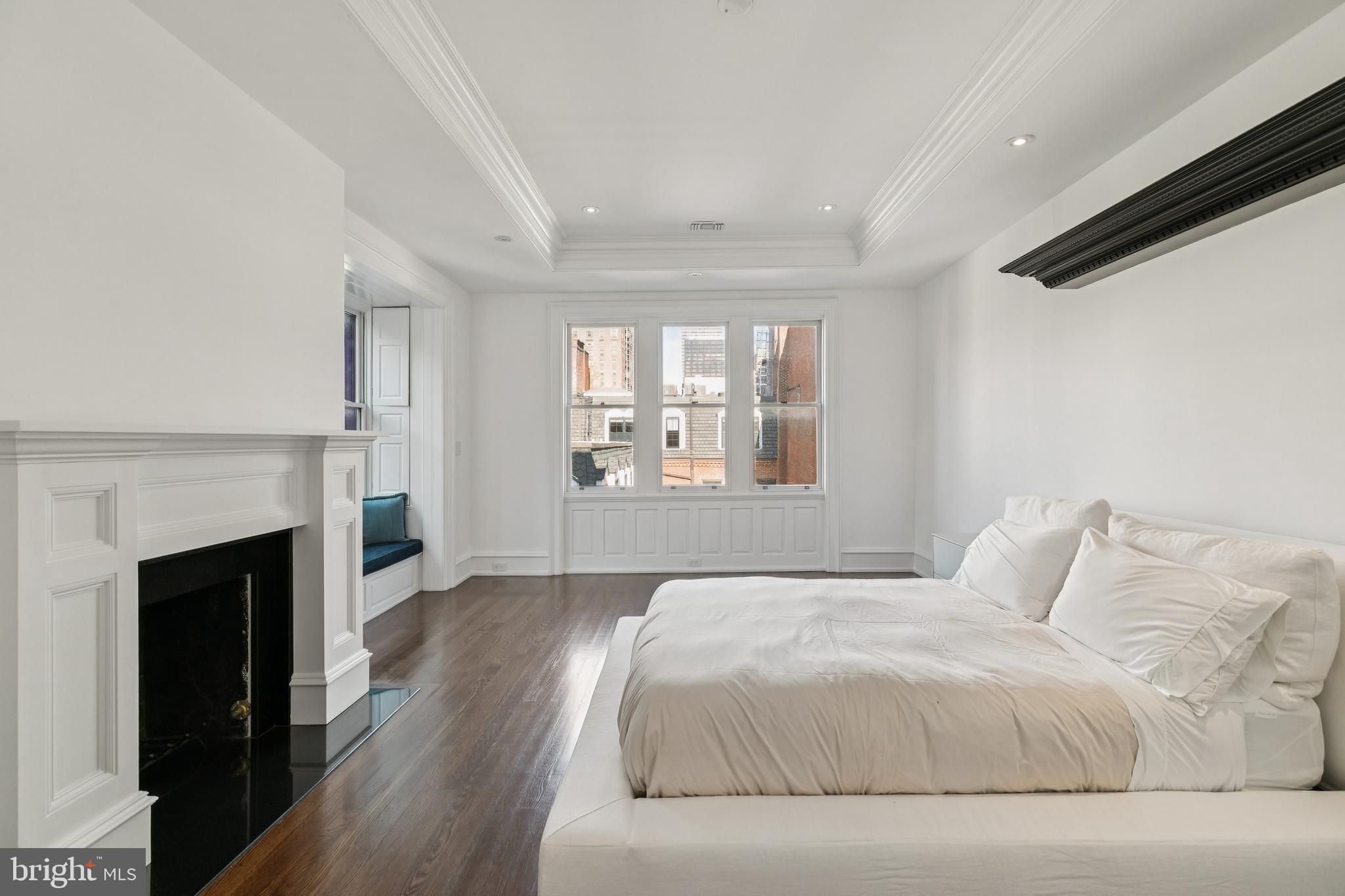 2015 Delancey Place Philadelphia, PA 19103 - Photo 26 of 38 a bedroom with a bed and a fireplace