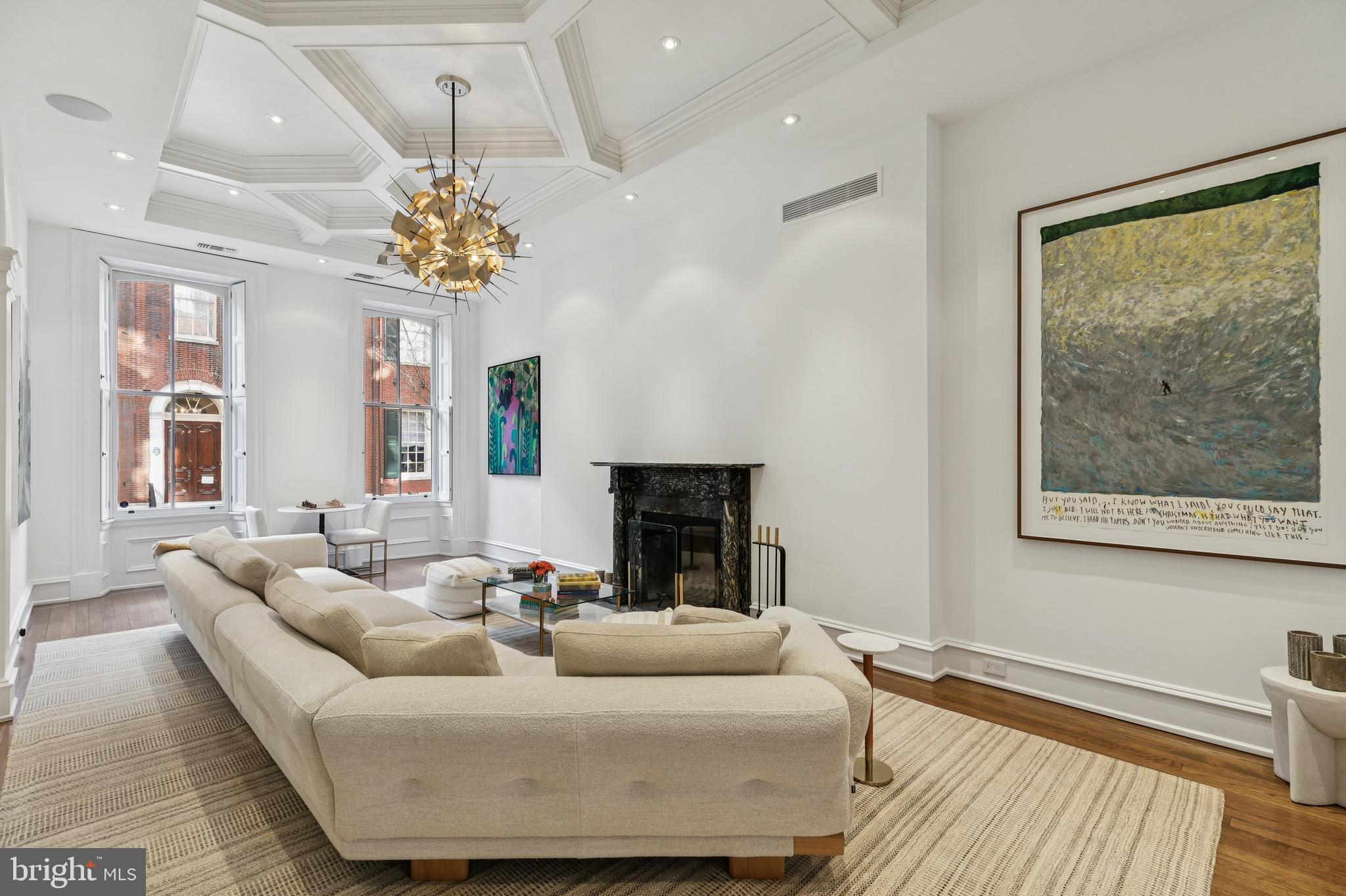 2015 Delancey Place Philadelphia, PA 19103 - Photo 4 of 38 a living room with furniture a chandelier and a fireplace