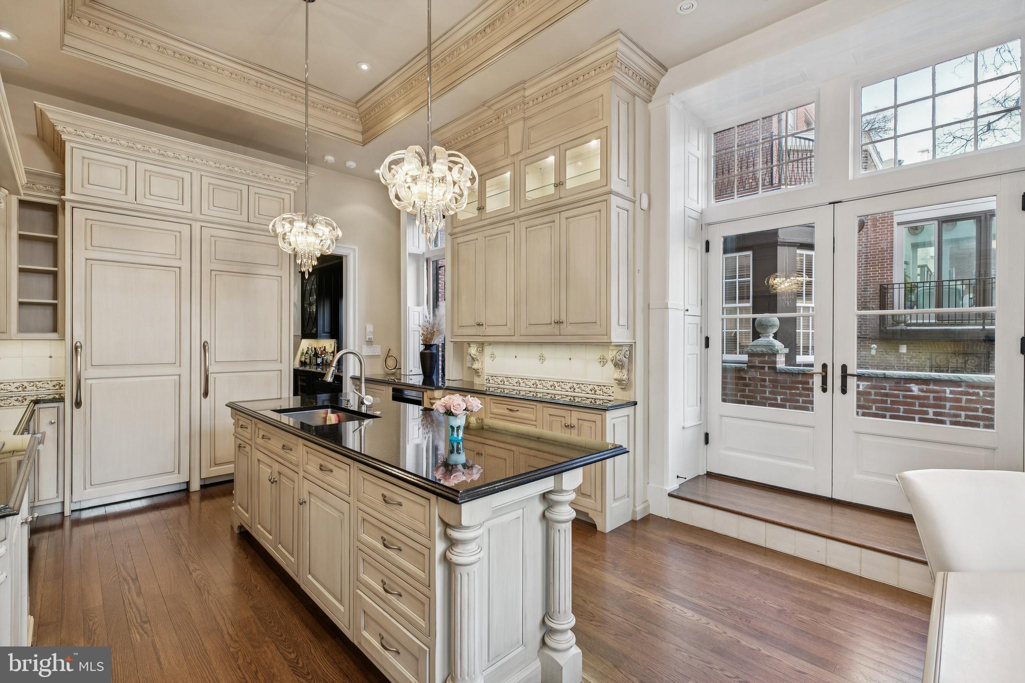 2015 Delancey Place Philadelphia, PA 19103 - Photo 9 of 38 a kitchen with granite countertop a sink cabinets and wooden floor