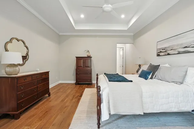 a bedroom with a bed and cabinet