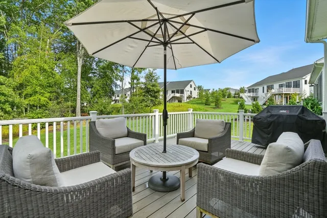 a balcony with table and chairs