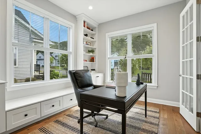 a view of a dining room with furniture window and wooden floor