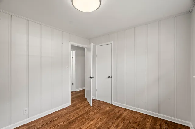a view of hallway with wooden floor