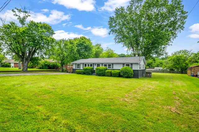 a view of a house with a big yard