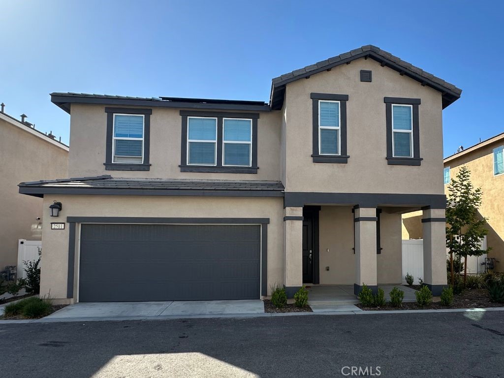 2511 Gunner Ridge Way Rialto, CA 92377 - Photo 2 of 37 a front view of a house with yard