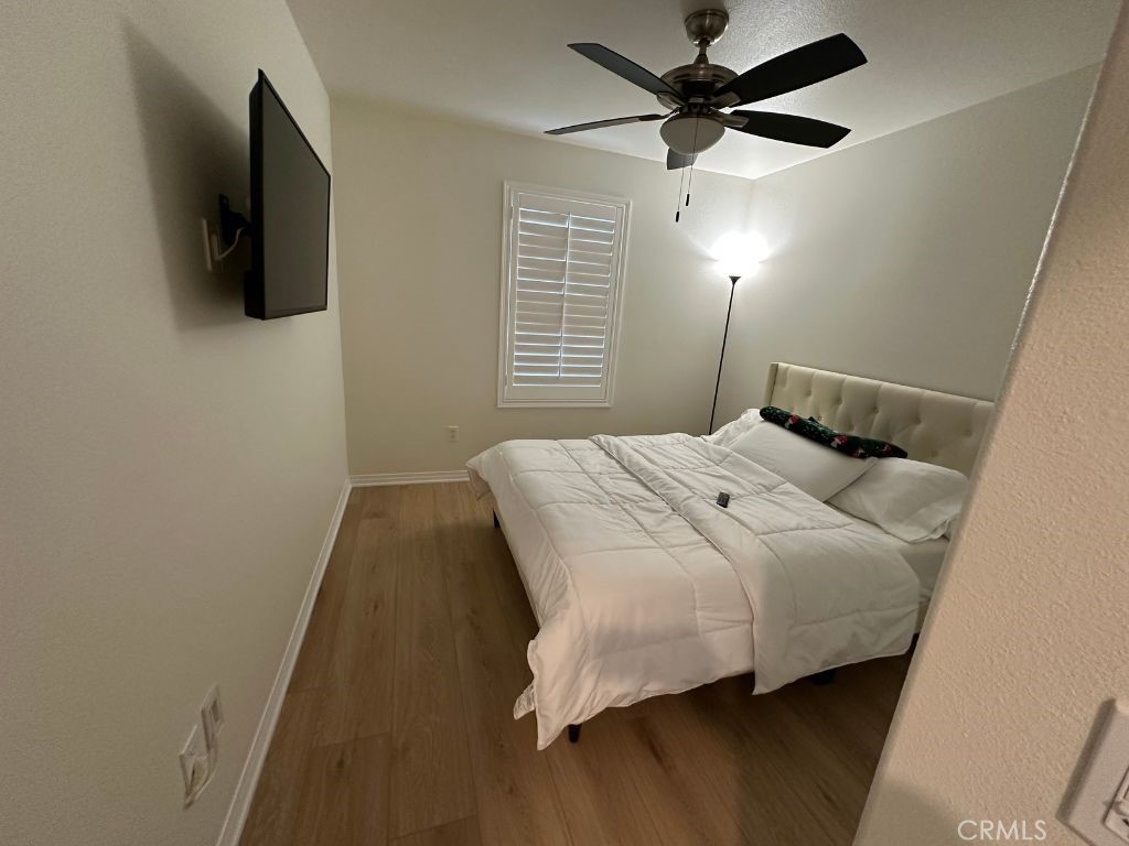 2511 Gunner Ridge Way Rialto, CA 92377 - Photo 26 of 37 a bedroom with a bed and a flat screen tv