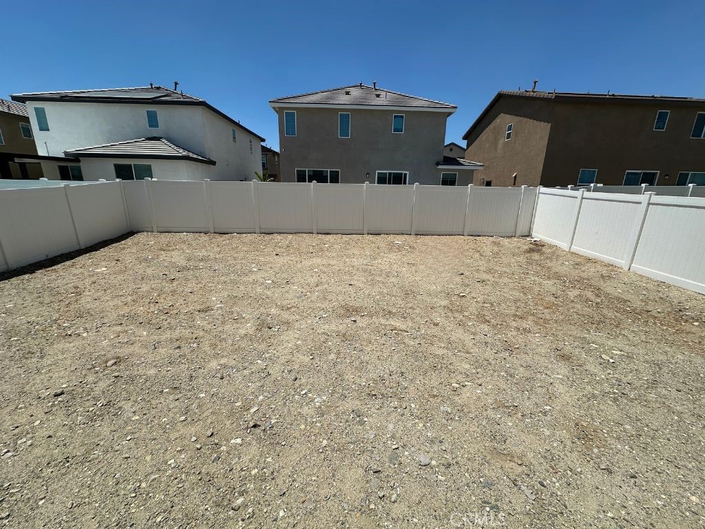 2511 Gunner Ridge Way Rialto, CA 92377 - Photo 31 of 37 a front view of a house with a yard