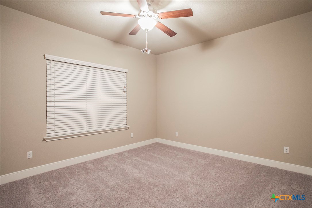549 Wills Point Way Belton, TX 76513 - Photo 16 of 31 an empty room with a window and a fan