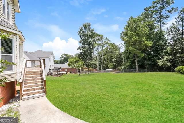 a view of a big yard with a fountain