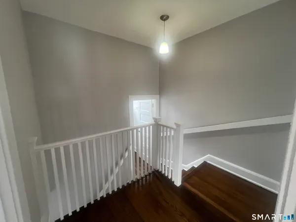 a view of entryway with wooden floor